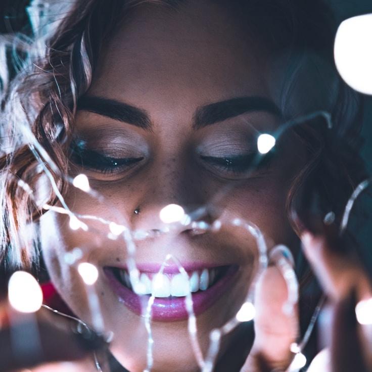 Kaveri Mehta, Lead Design Curator at CobaltMeadowRift, reviewing corporate floral arrangements